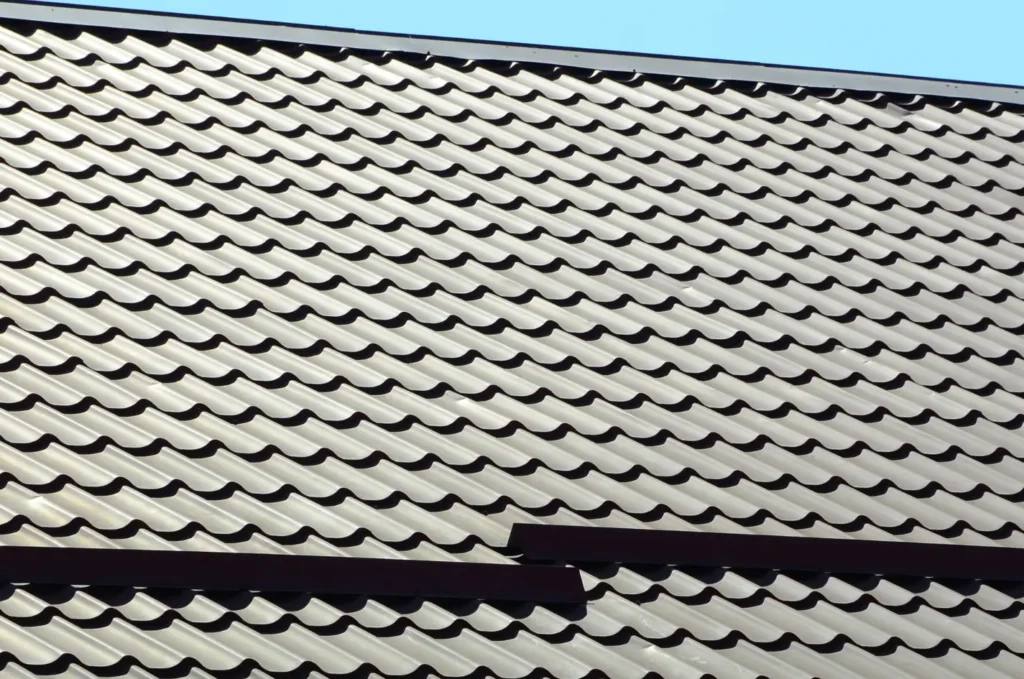 Metal tile roof with clean lines and even spacing, showing the type of surface examined during a routine roof inspection