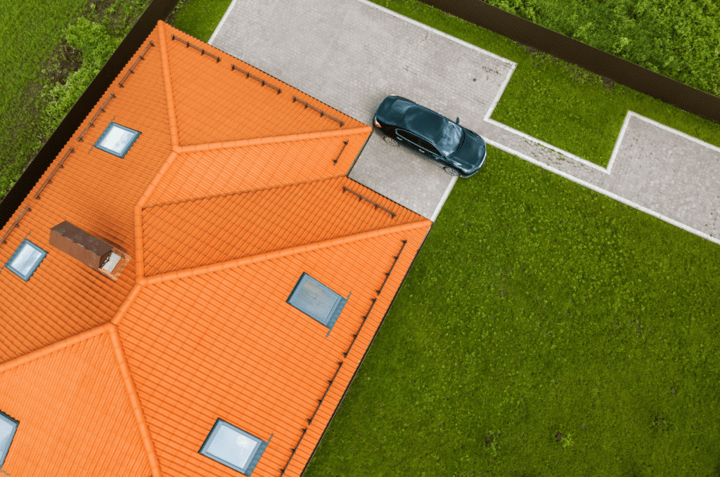 Aerial view of a residential roof during a home roof inspection before buying a Boston property. 