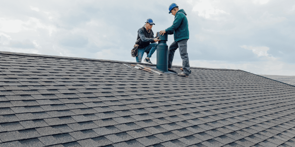 Roofing specialists inspect a home roof after heavy rain and strong winds during a professional Boston roof inspection visit.