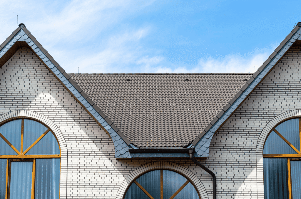 Roof valleys, flashing, and drainage areas checked for leak risks during a professional roof inspection after heavy rain.